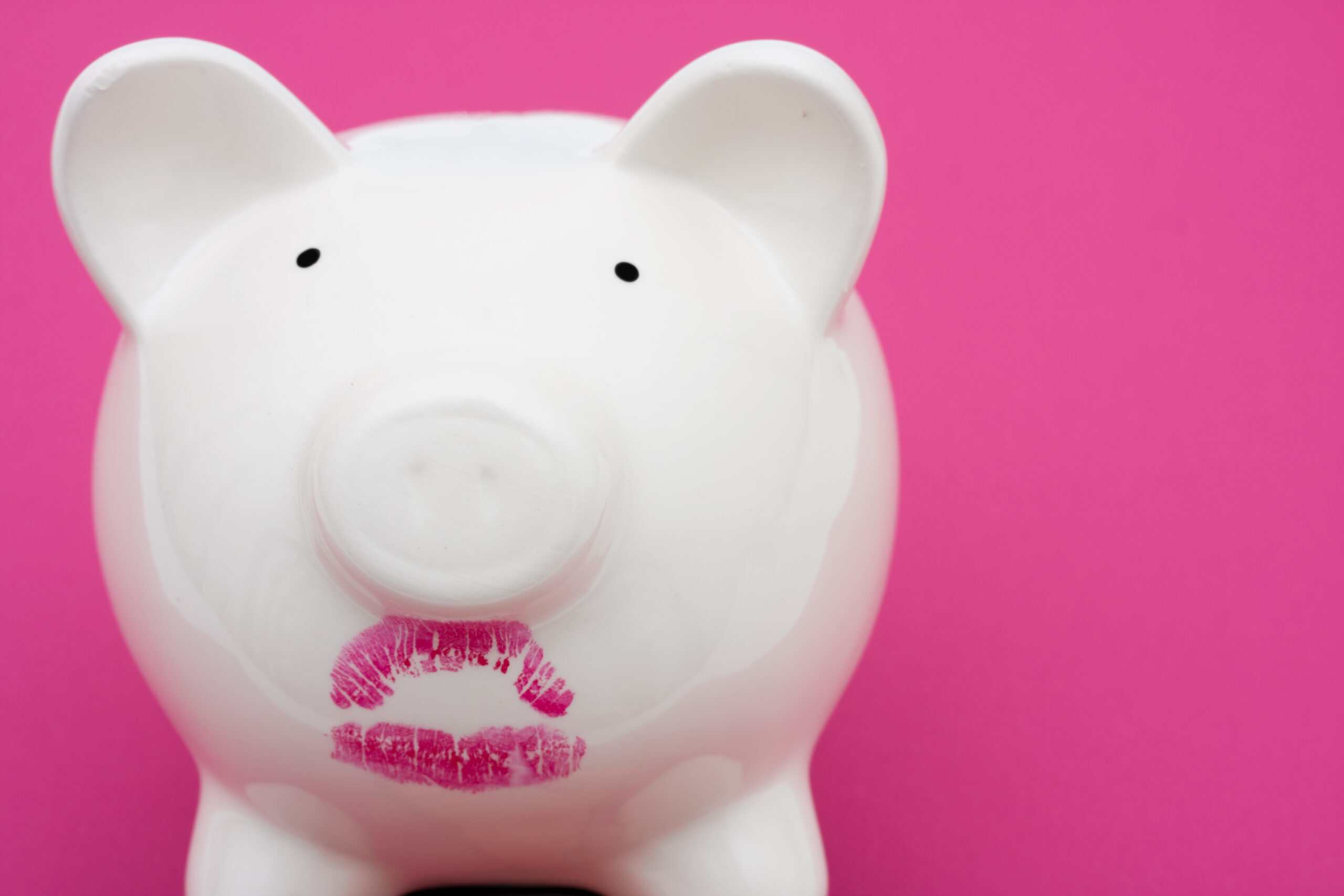 A piggy bank with lipstick on